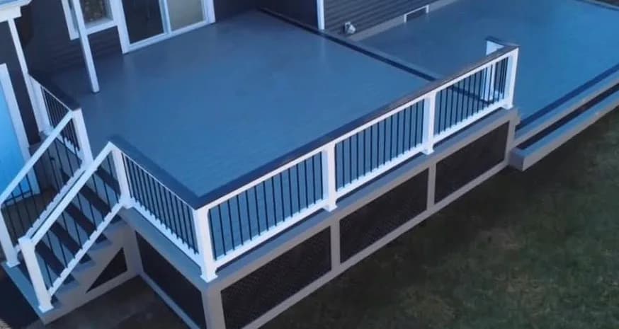 Raised composite deck with contrasting railings